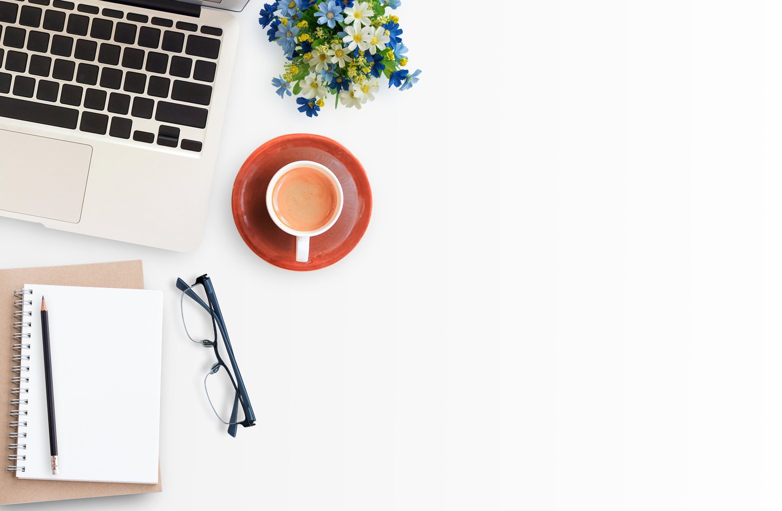 Laptop, Notebook, and Coffee on White Desk 